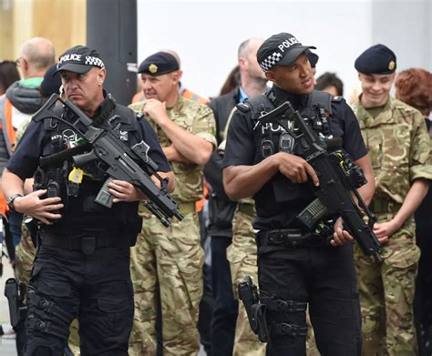 Residents described how heavily armed officers surrounded the house, shouting instructions for the occupants to come out peacefully. . Liverpool armed police
